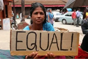 Photo of women holding a sign with the words "Equal"