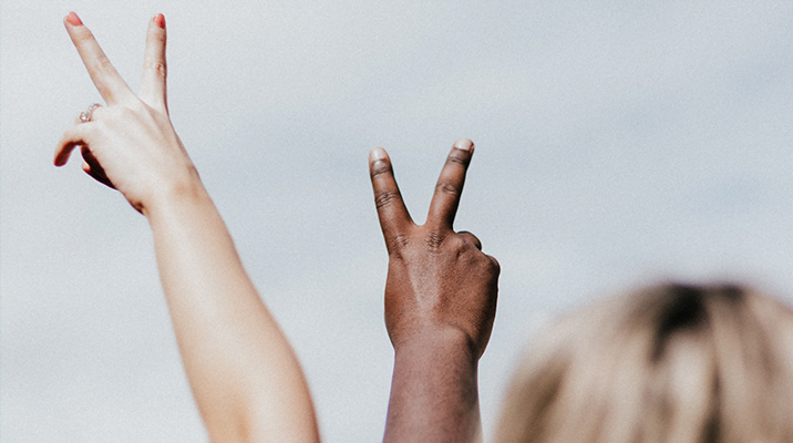 Hands making the sign for peace