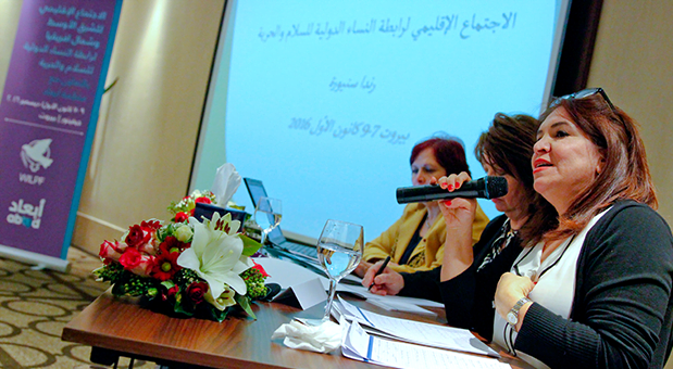 A woman is speaking in a panel during WILPF regional convening 2006